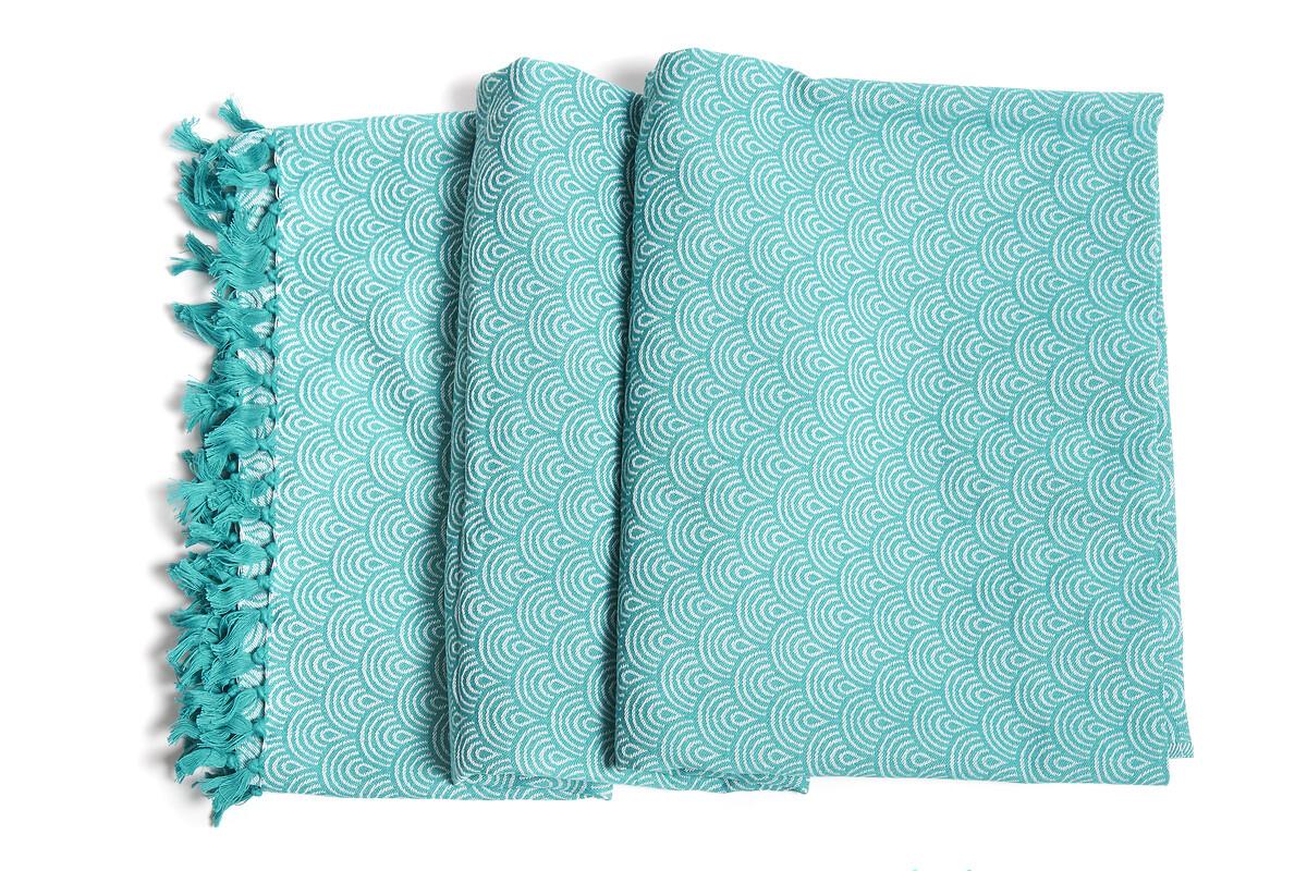 Serviette de bain turquoise aux motifs blancs arrondis en coton bio. Modèle Hammam Large
